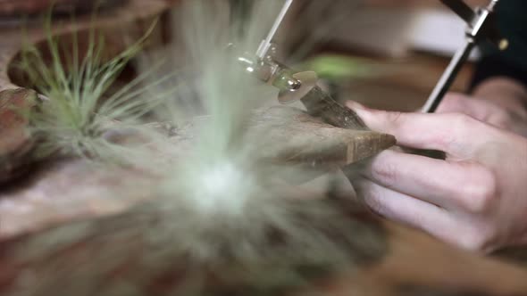 Crop woman working on creation of jewelry