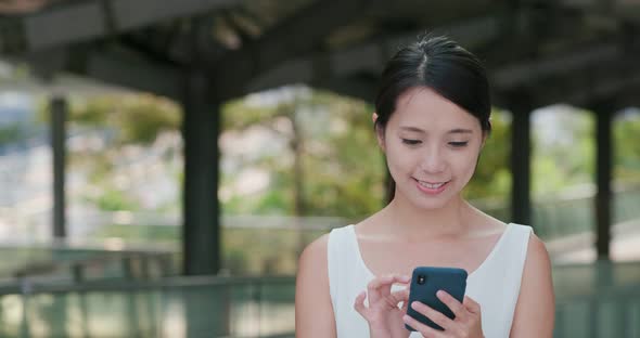 Woman use smart phone at outdoor