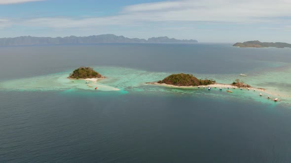 Small Torpic Island with a White Sandy Beach, Top View