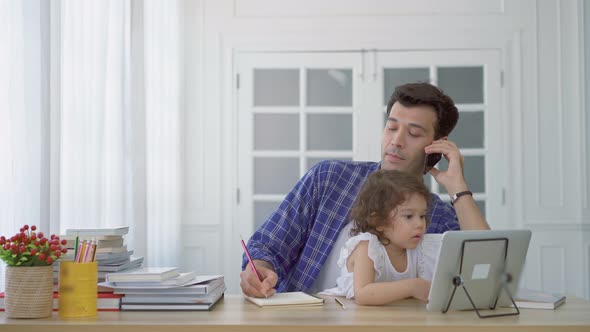 Business dad trying to work by making a phone call while take care his daughter together in home