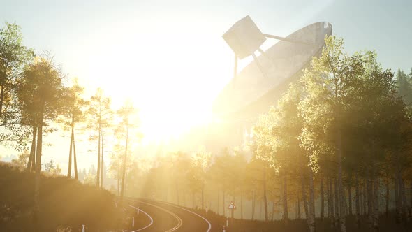 The Observatory Radio Telescope in Forest at Sunset