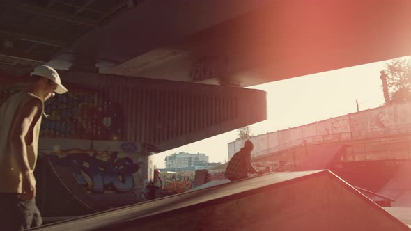 Active People Riding Together at Urban Skate Park