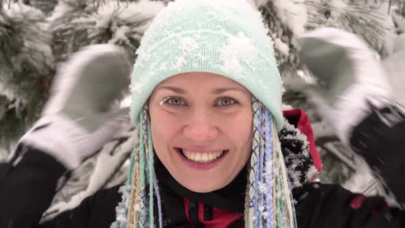 Portrait of a Happy Woman Outdoors in Winter
