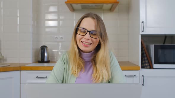 Entrepreneur businesswoman speaking with client online on webcam in laptop computer in 4k video