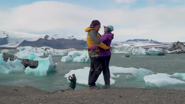 Happy a Man and a Woman Near Glacier Lagoon