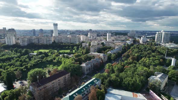 Aerial View of Metropolis City Skyline with Skyscrapers Green Trees and Sky