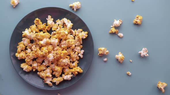 Popcorn in a Bowl on Wooden Desk