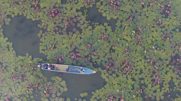 Aerial View on Boat with People
