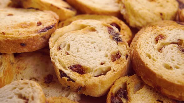 Pile of baked rusks with raisins. Macro