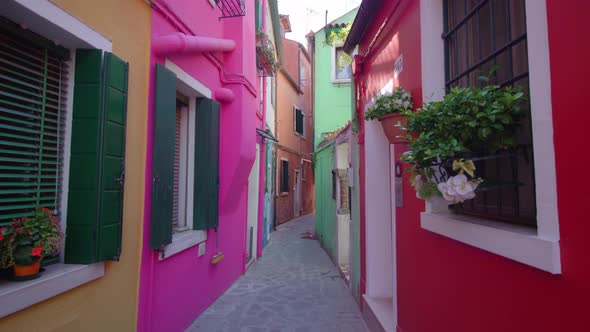 Narrow Street Between Houses and Windows with Shatters