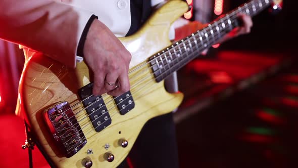 Musician Playing the Guitar During a Live Performance