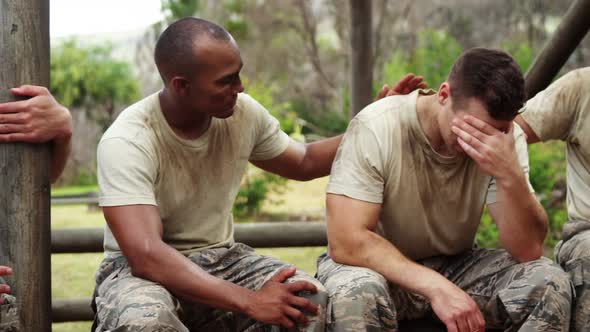 Militray soldiers consoling their teammate at boot camp 4k