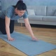 Sportive Woman Does Plank Exercise in Room - VideoHive Item for Sale