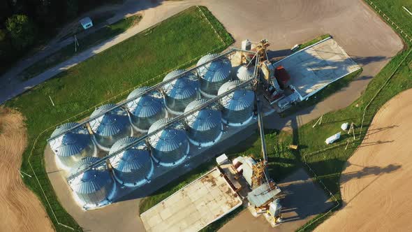 Aerial Elevated Top View Modern Granary Graindrying Complex Commercial Grain Or Seed Silos In Sunny