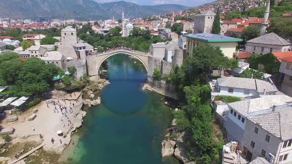 Crowd watching people jumping of the bridge in Mostar