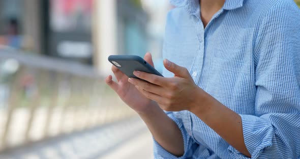 Woman use of smart phone at street