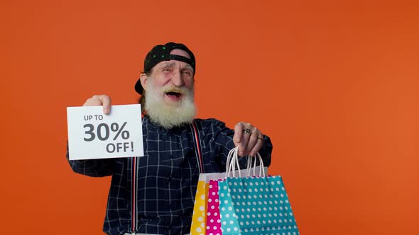 Elderly Bearded Man Showing Shopping Bags and Up To 30 Percent Off Inscriptions Text Black Friday