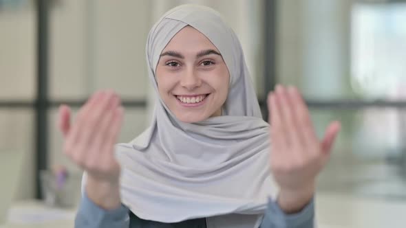 Young Arab Woman Pointing at Camera Inviting