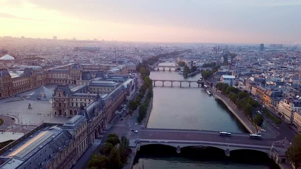 Morning panning footage of Paris from drone. Large complex of Louvre museum with Place du Carrousel