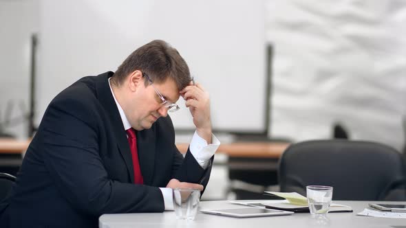 Sorrowful Boss Having Corporate Trouble Feel Headache and Depression  Footage