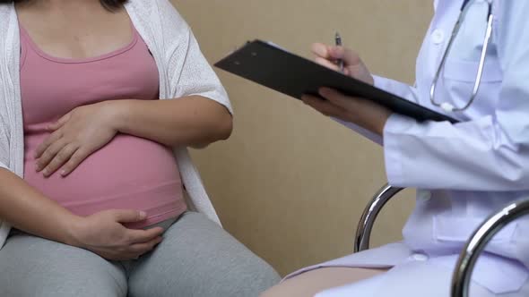 Pregnant Woman and Gynecologist Doctor at Hospital