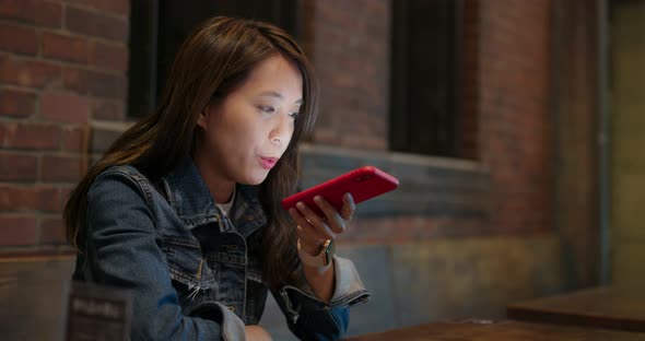 Woman use of mobile phone for order food in restaurant