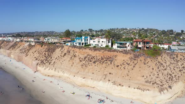 Drone shot orbiting over Solana Beach coastal city in San Diego, USA