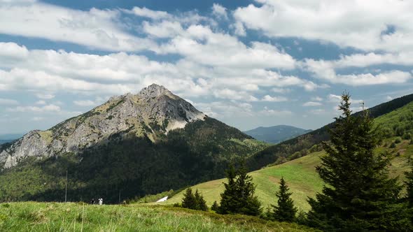 Fast Moving Clouds and Shadows over Peak and Trees in Mountains