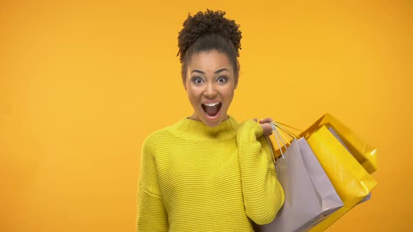 Cheerful Woman With Shopping Bags and Golden Credit Card, Rich Customer Service