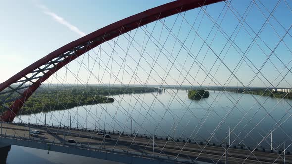 Huge Rope Road Bridge Against the Background of Blue Water and Blue Sky