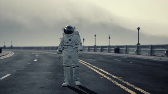 Astronaut Walks in the Middle of a Road alt