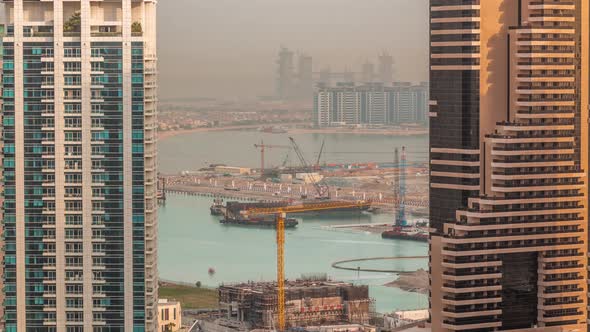 Aerial View to Dubai Marina Skyscrapers with Construction Site and Palm Jumeirah Island on