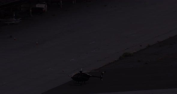 Aerial helicopter wide shot, tracking behind lone bull moose running through the snowy Alaskan tundr