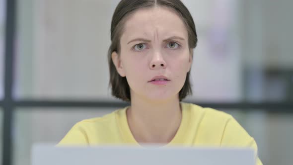 Close Up of Woman with Laptop Shaking Head As No