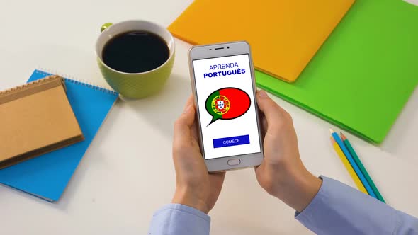 Portuguese Language Application on Smartphone in Persons Hands