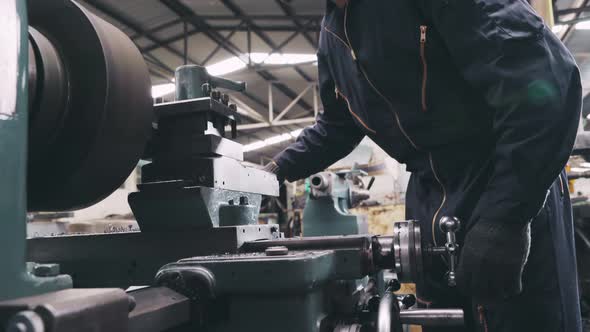 Smart Factory Worker Using Machine in Factory Workshop