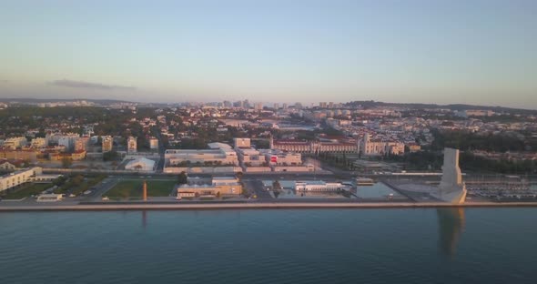 Rising left the discovery pattern in the riverside area of ​​Belem, Lisbon, Portugal. huge sunrise