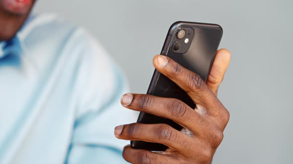 Young emotional man in shirt talking via video call