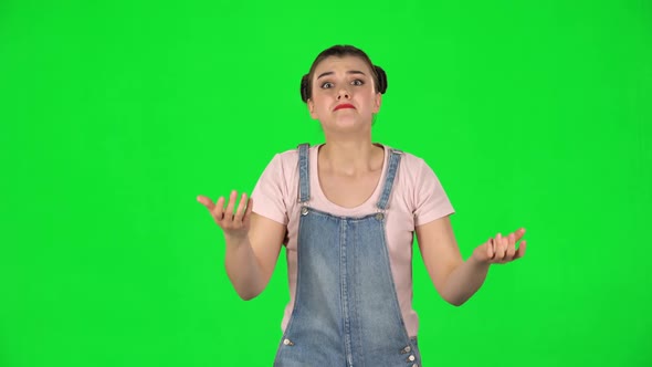 Girl Looking at Camera with Anticipation, Then Very Upset Against Green Screen
