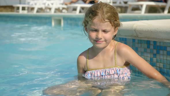 Little Girl Sitting in the Water