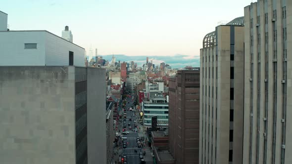 Descending Shot of Modern High Rise Building with Glossy Glass Facade