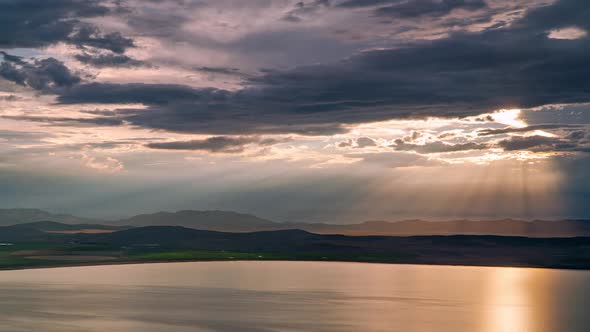 Time lapse of sun rays beaming through the clouds over Utah Lake