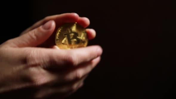 Woman Hand Holding Cryptocurrency Golden Bitcoin Coin Ondark Background