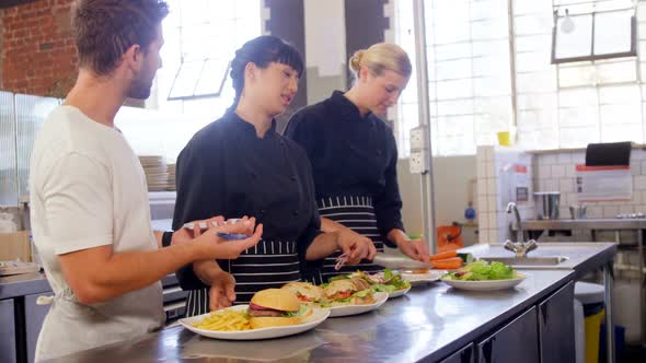 Manager giving order to chef in commercial kitchen 4k