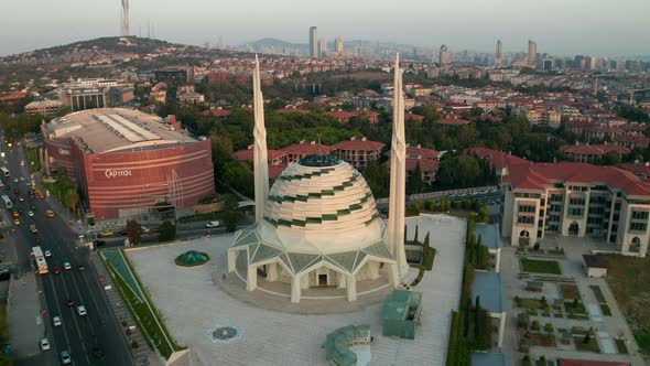 Futuristic Mosque in Istanbul, Modern Looking Temple at Sunset with Cityscape, Aerial Forward