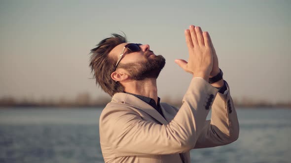 Businessman Prays And Looking On Sky. Handsome Man Pray With Hope Faith Hold Hands Together.