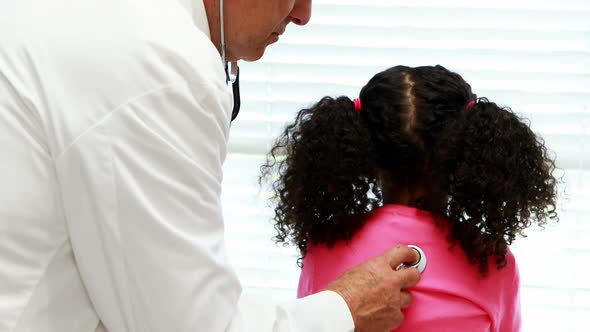 Male doctor examining a patient