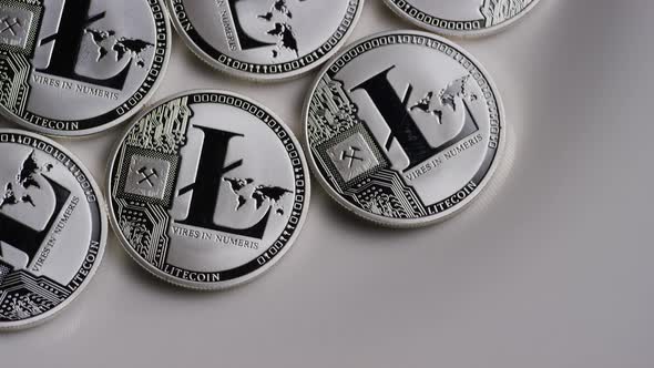 Rotating shot of Litecoin Bitcoins (digital cryptocurrency) - BITCOIN LITECOIN 0108