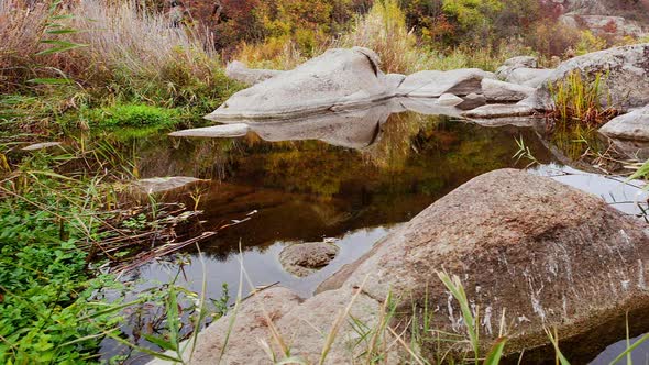 Autumn Trees and Large Stone Boulders Around