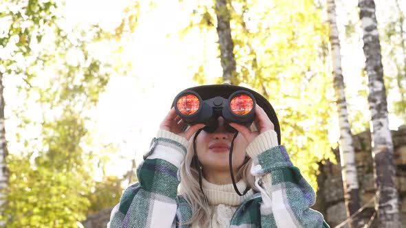 Woman Use Binoculars While Travelling, Tourist Looking Through Binoculars.